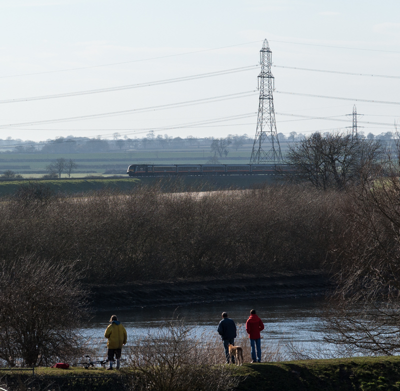 Watching the Diversions
Enthusiasts on the bank of the River Trent watch ECML diversions. Grand Central's 43484+43423 approaching.
