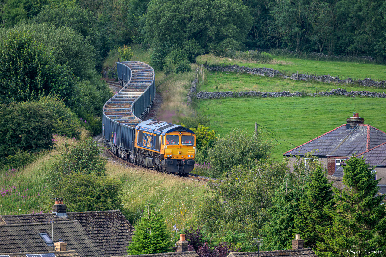 S Curve
GBRf Class 66/7 No. 66728 'Institution of Railway Operations' passes Harpur Hill working 4H96, the 13:02 Wellingborough – Hindlow Quarry empty JNA wagons on 22nd July 2024.
