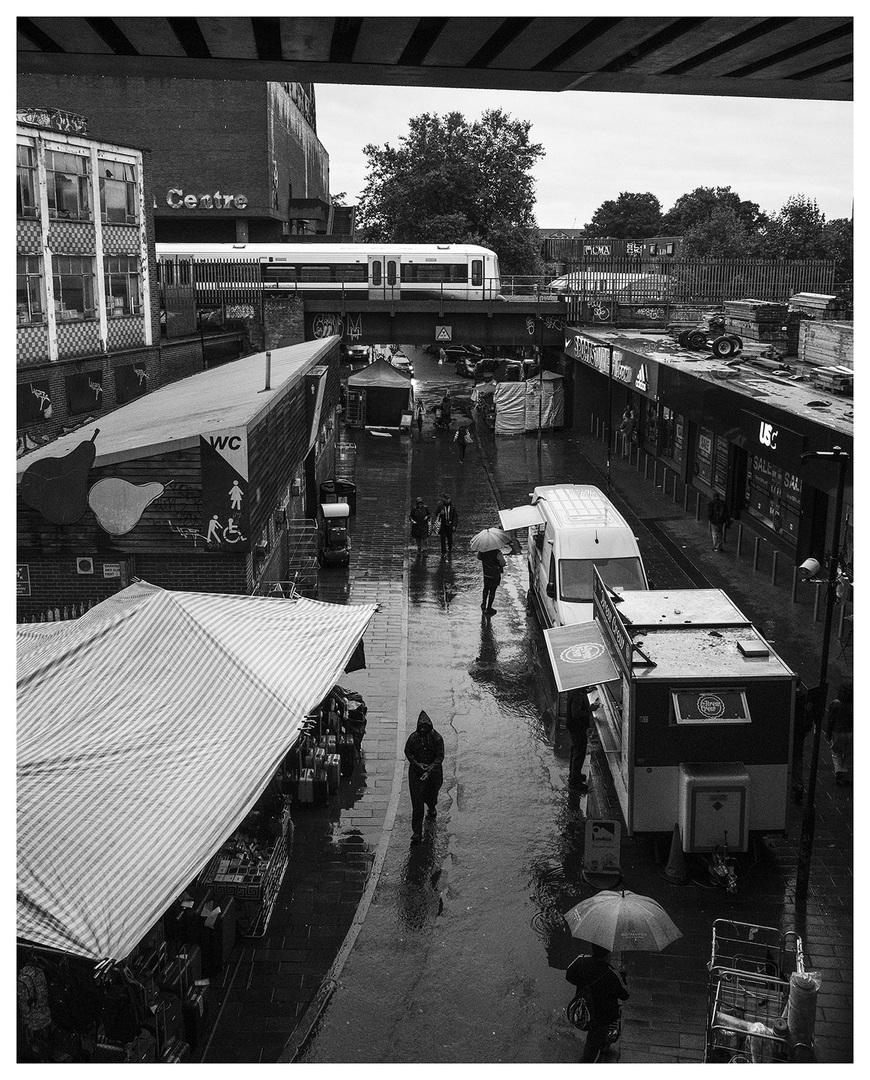 Brixton Market
A train bound for Victoria crosses Brixton market during a heavy shower.
