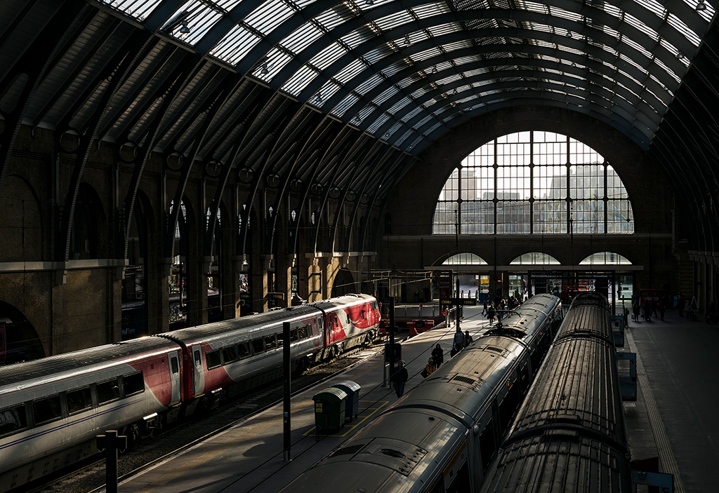 Picking Out the Red
Strong autumn backlight reduces the impact of colour in this scene at Kings Cross, with the exception of the red livery on the Virgin Trains East Coast Class 91 set. This was early afternoon on Sunday 19 November 2017.
