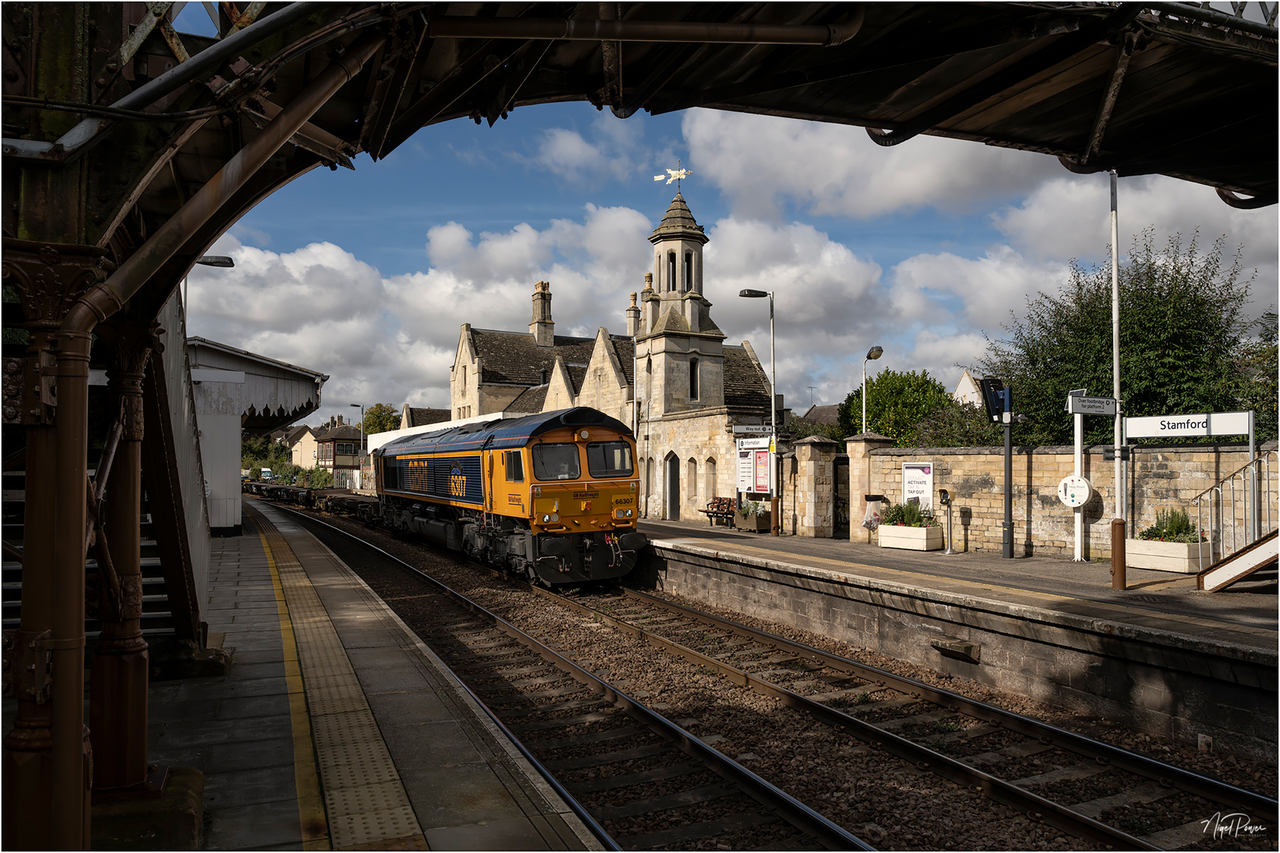 'Ipswich Town' at Stamford
A view of the beautiful Grade II-listed station at Stamford in Lincolnshire. At 1057hrs on Tuesday 17 September 2024, GBRf loco no. 66307 'Ipswich Town' passes through at the head of 4L05, the Ditton (O'Connor) GBRf (0545hrs) to Felixstowe South working.
